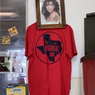 a t - shirt hanging on a wall