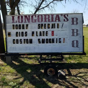 a sign for longoria's bbq