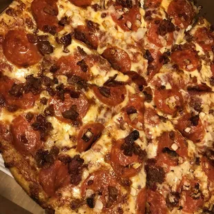 Bacon, pepperoni, salami and onion.