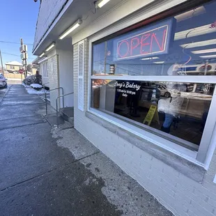 a window with a sign that says open