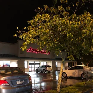 cars parked in a parking lot at night