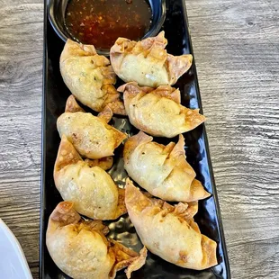 Pork fried wontons w/ a sweet chili dipping sauce