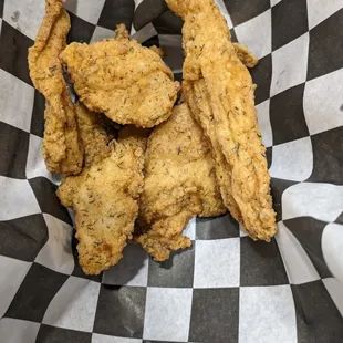 Hand breaded chicken strips.  Also available gluten free!