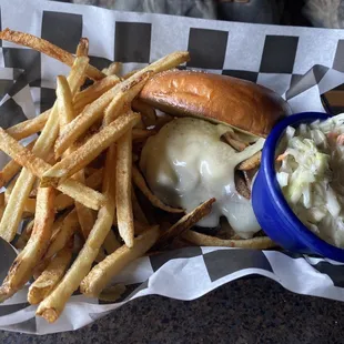 Mushroom and Swiss burger with french fries and coleslaw