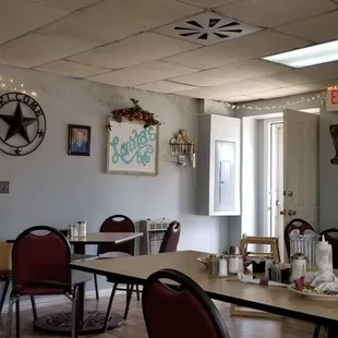 a dining room with tables and chairs