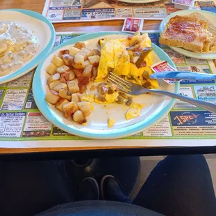 Western omelet, home fries, sausage gravy over biscuits