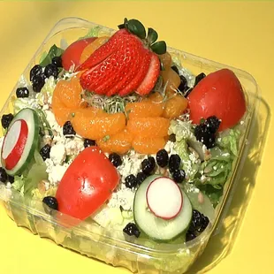 a salad in a plastic container