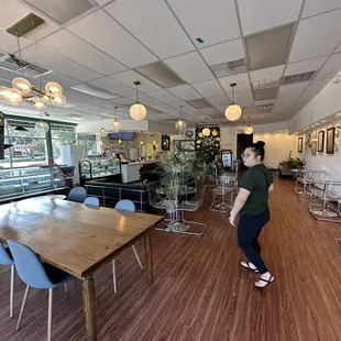 a woman standing at a table