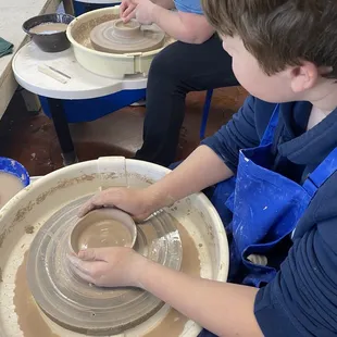 Nearing completion but listening and watching the instructor.