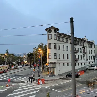 a view of a city street at dusk