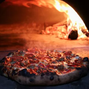 Wood-fired pizza served hot and fresh every Friday!