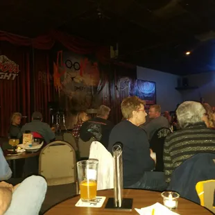 3 tables back from the front stage, the area hold around 200 people comfortably