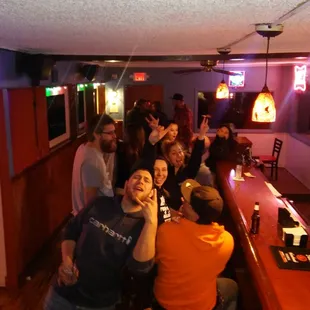 a group of people at a bar