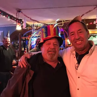 two men with hats on