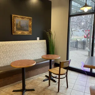 a table and two chairs in a coffee shop