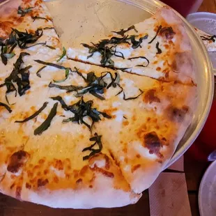 a pizza with a slice taken out of it