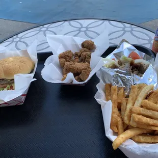 Boneless chicken cubes, cheese burger  and fries