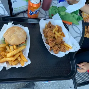 Boneless chicken breast and cheese burger with fries