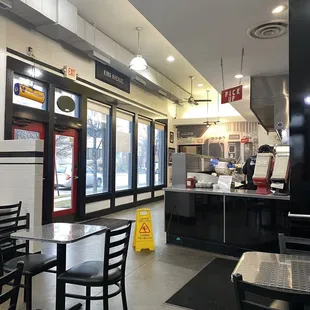 a restaurant with tables and chairs