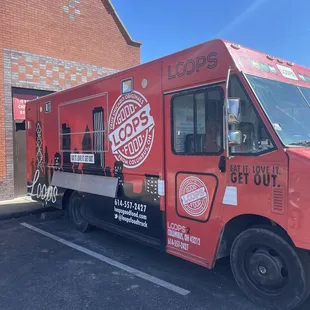 Food truck parked in the back of the restaurant.