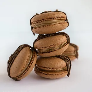 a stack of chocolate macarons