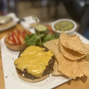 a burger with cheese and chips