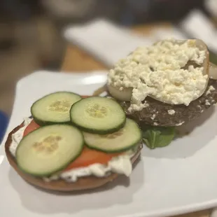a sandwich with cucumbers and feta cheese