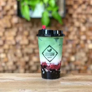 Strawberry Matcha Latte made with Japanese Matcha, Straus Organic Milk, and Real Strawberry Compote.