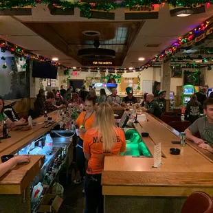 customers sitting at the bar