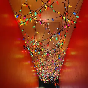 a hallway decorated with christmas lights