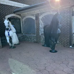 Front entrance with Black and White Stallions ( horses )...