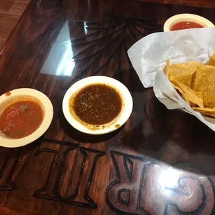 The dark color salsa is hot and delicious