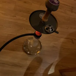 a glass table with a hook on it