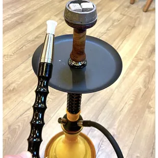 a hand holding a hook with a hook on it