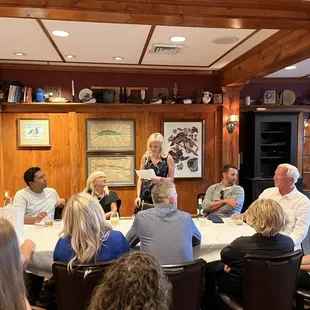 a group of people sitting around a table