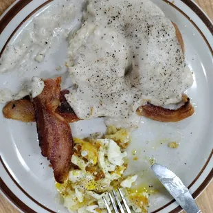 Biscuits and gravy, bacon, and 1 over easy egg mixed in with some stolen hash browns that I got from my hubby lol
