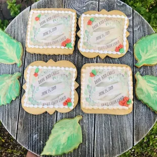 four decorated cookies on a table