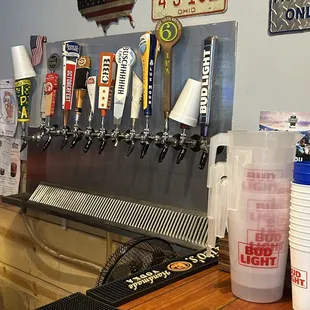 a row of beer taps