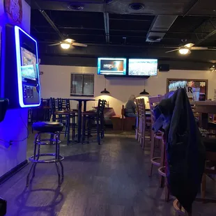 a bar with neon signs