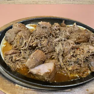 a plate of meat and gravy