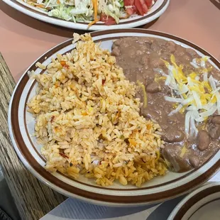 a plate of rice, beans, and beans