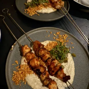 The octopus brocheta!!!  Must order!!  In the back are the scallops..good too, but if you had to choose, go with the octopus!