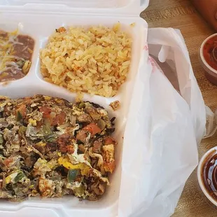 a meal in a styrofoam container