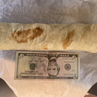 Skinny Carne Asada Burrito.  A $5 bill only gets you a half skinny Burrito.