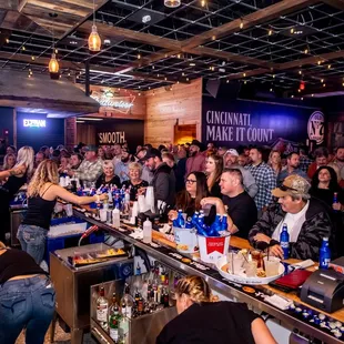 a crowd of people at a bar