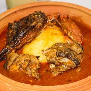a bowl of stew with meat and potatoes