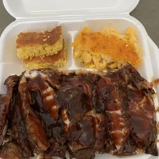 Jerk chicken with bbq sauce, Mac n cheese and cornbread