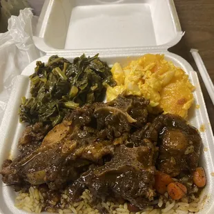 Oxtail, greens, Mac n chz. Hubby had the Goat and it was tender!Okay then! Have the Dweet Tea with Pineapple.