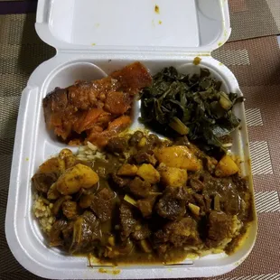 Regular sized goat curry with collard greens and yams