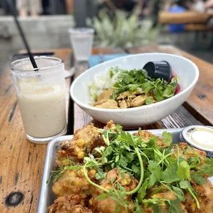Corn fritters, horchata pina mocktail, and chicken curry with coconut scented rice.